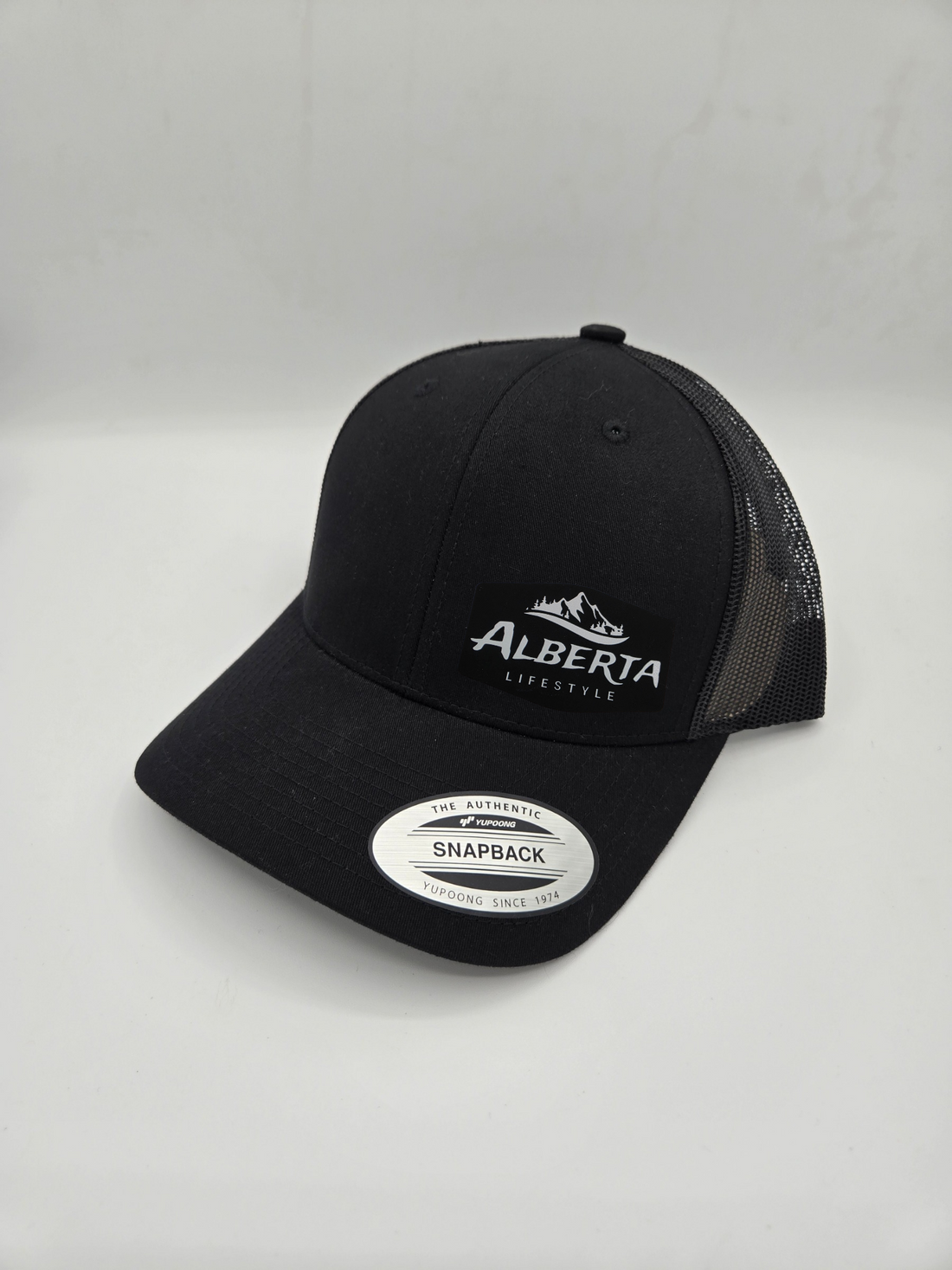 Mountain Heritage ™ Leather Patch Trucker